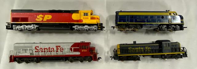4 HO Scale Train Engines: 4 HO Scale Train Engines. Good Condition. 3 Santa Fe 1 SP Photo's are considered part of the
