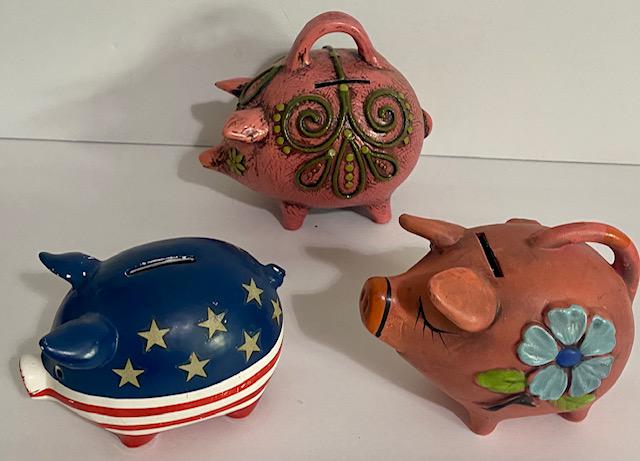 3 Vintage Piggy Banks FF: 3 Vintage Ceramic Pig Piggy Banks. *One marked F.F. (Fitz Floyd) Apx. 7" x 6" T. *Pink with Blue Flowers Apx. 5 1/2" W x 4 1/2" T. *Red, White & Blue Apx. 5" W x 3" T.