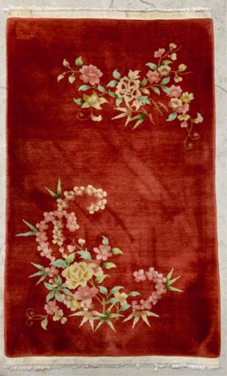 Chinese Oriental Copper Color Throw Rug: Chinese Oriental Copper Color Throw Rug. w/ Greens, Pinks, and Beige's. Apx. 5' x 36". Photo's are considered part of the description and condition.