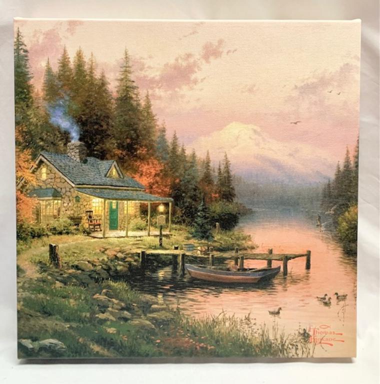 Thomas Kinkade Print on Canvas w/COA: Thomas Kinkade Print on Canvas w/COA 2013 Apx 14" x 14". Lake, Mountain, Cottage Scene. Photo's are considered part of the