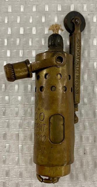 1912 Brass Trench Lighter- JMCO Austria: 1912 Brass Trench Lighter. JMCO - April 2, 1912. Made in Austria. Austrian Pat #89539. Photo's are considered part of the