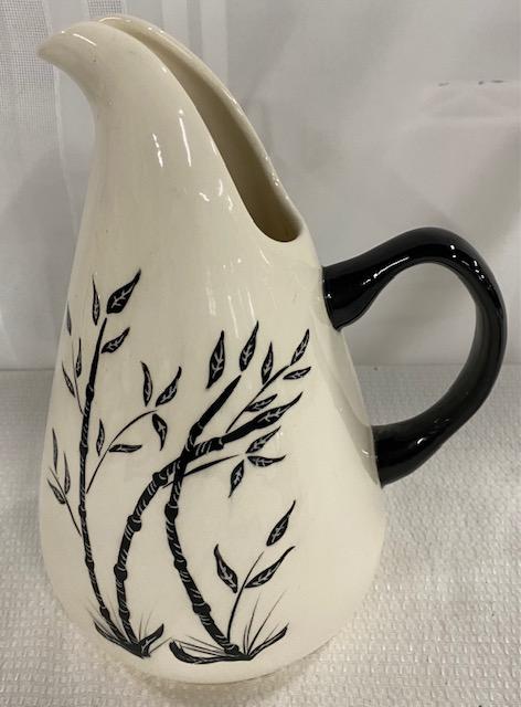 Russell Wright Pitcher: Russel Wright Pitcher. Black on White. Apx. 10 3/4" T x 9" W. Photo's are considered part of the description and condition.