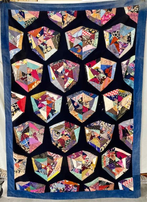 Small Neck Tie Type Quilt: Small Neck Tie Type Quilt/Throw. Satin Back. Corduroy Edge. Some Squares of Silk are worn. Aprx. 44" W x 63" T.