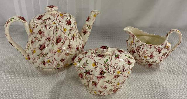 Copeland Spode Teapot, Creamer, & Sugar: Copeland Spode Teapot, Creamer, & Covered Sugar. "Rosebud Chintz". Discoloration inside Sugar Bowl. Photo's are considered part of the