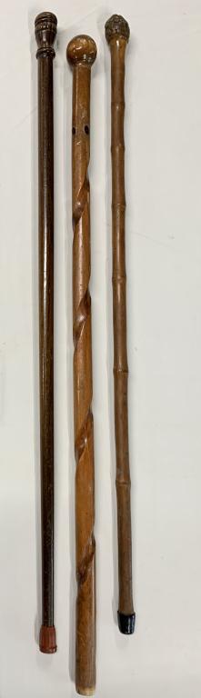 3 Vintage Ball/Knob Handle Canes: 3 Vintage Ball/Knob Handle Canes. *Dark wood Cane with Red Rubber Tip Apx. 34". *Carved Swirl Cane with Ball/Knob Top no end Apx. 34". *Pine Cone Look Knob Top with Black Rubber