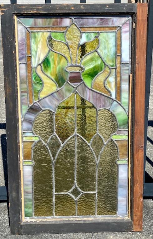 Beautiful Vintage Leaded Stained Glass Window: Beautiful Vintage Leaded Stained Glass Window Window Frame apx. 31 1/4" H x 19 1/2" W. Stained Glass apx. 14 1/2" x 28" H. There is a small crack in the Upper Yellow Pedal (See Photos). Photos are con