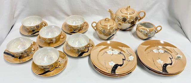 Vintage Hand Painted Luster Tea Set: Vintage Hand Painted Luster Tea Set. Made in Japan. 6 Cups 6 Saucers - 1 non matching. Tea Pot.Creamer.Covered Sugar.6 Plates 7 1/4" (crack on 1 plate under the glaze)Photos are considered part of the