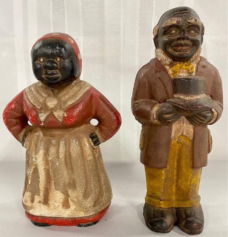 Pair of Cast Iron Banks- Butler & Cook: Pair of Cast Iron Banks. Butler Apx. 8 1/2" H. Cook Apx. 7 1/2" H. Photo's are considered part of the description and condition.