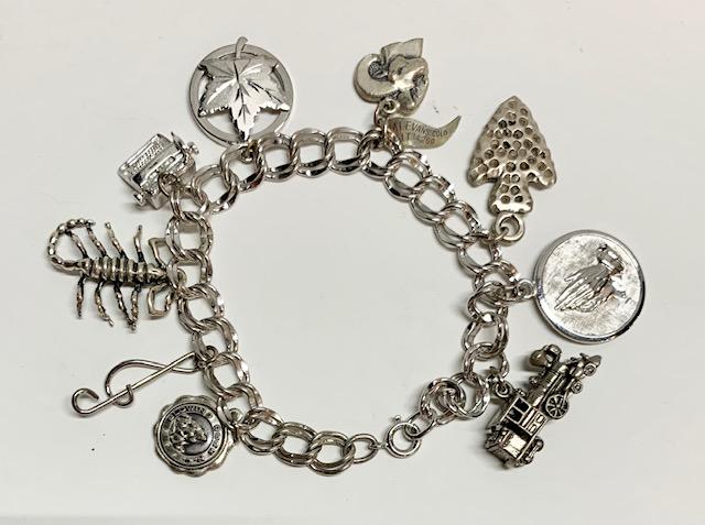 Sterling Charm Bracelet: Sterling Charm Bracelet. Apx. 7" Photo's are considered part of the description and condition. 905
