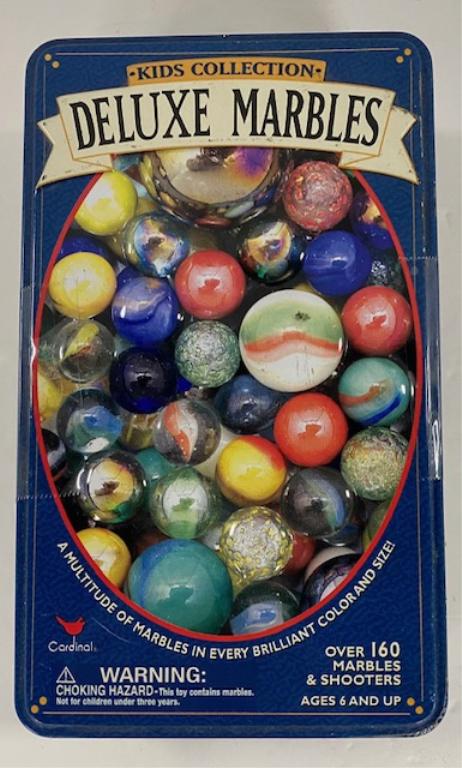 Collection of Marbles in a Tin: Collection Marbles in Tin Contents are not what is depicted on tin. See photo Apx. 4 1/2" x 7 1/2". Photos are considered part of the description and condition.