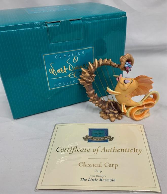 Disney Carp - Little Mermaid Collection: Walt Disney Little Mermaid Collection Adorable Carp playing a Shell Harp. 5" x5" x 2 1/2" COA included. With Original Box. Photos are considered part of the description and condition.