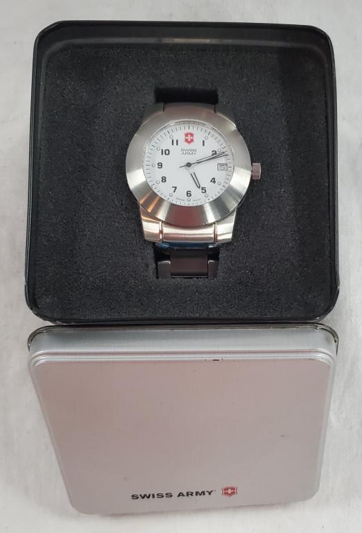 Swiss Army Watch with Presentation Tin: Swiss Army Watch with Presentation Tin Victorinox - Legacy Fasilitator Stainless Steel Water Resistant to 100 Meters Removeable Links. Instructions included. Nice Condition. Photo's are considered par