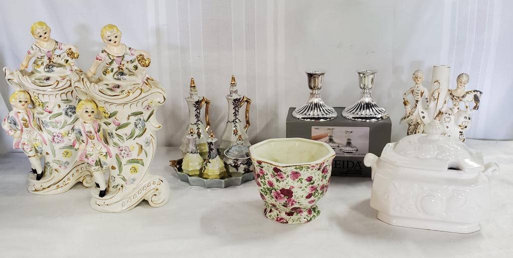 Assortment of Collectible Porcelains: Assortment of Collectible Porcelains. Oneida Candle Sticks. Flower Vase Gravy Goat Table/Tea Accessories Figurines have cracks on the tops as pictured. Tea Setting has crack and chips. Photo's are con