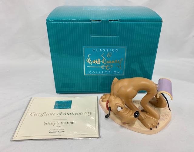 Disney 1998 Pluto "Sticky Situation": Walt Disney 1998 Pluto "Sticky Situation". Animator's Choice. "Sticky Situation" - Pluto - Beach Picnic. With Original Box and COA. in Like New Condition. Figurine Apx. 5 3/4" W x 3 1/4" H. Photo's ar