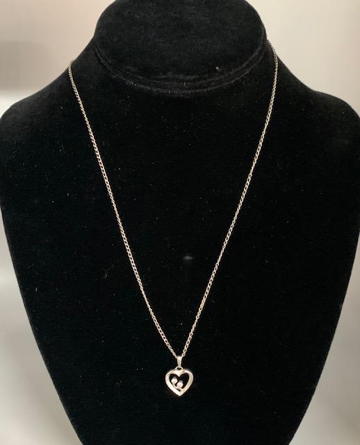Sterling Necklace with Heart Pendant: Sterling Necklace with Sterling Heart Pendant. 20" Photo's are considered part of the description and condition.