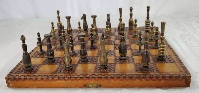 Chess Set-Wood Case -32 Brass Pieces: Chess Set - Burnt Wood Case Made in Israel. Fold up Case opens to Board. 32 Brass Pieces. Vintage Used Condition. Brass hinges and latch. Apx. 10" L x 5" W x 1 1/2" H. Photo's are considered Part of t