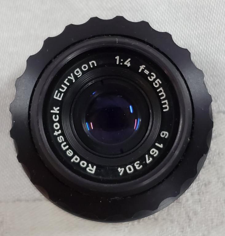 Rodenstock Eurygon 1:4 F-35mm Lens: Rodenstock Eurygon 1:4 F=35mm Lens with Lens Covers. #6167304. Photos are considered part of the description and condition.
