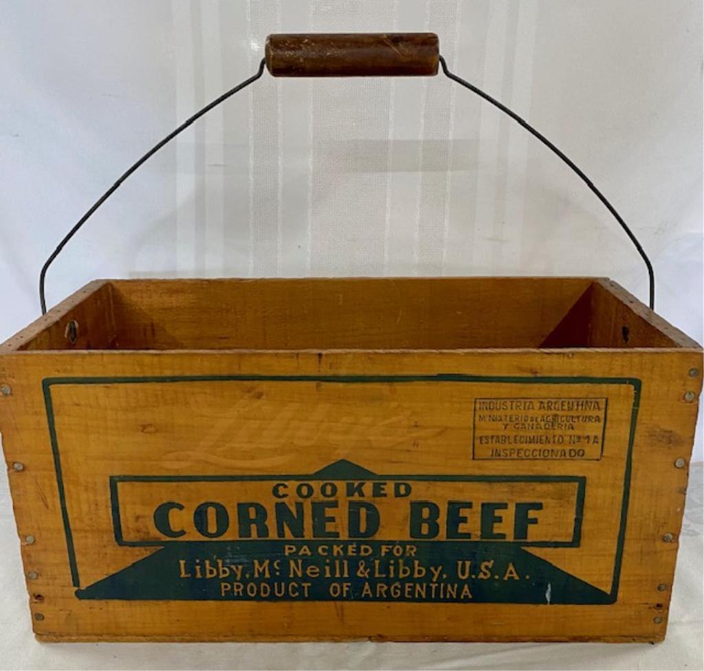 Vintage Libby Corned Beef Wood Box w/Handle: Vintage Libby Corned Beef Wood Box with Bail Handle. Product of Argentina. Good Graphics on 3 Sides Great Condition. Apx. 15 1/4" W x 7 1/2" H (not including handle) x 7 1/2" D. Photos are considered 