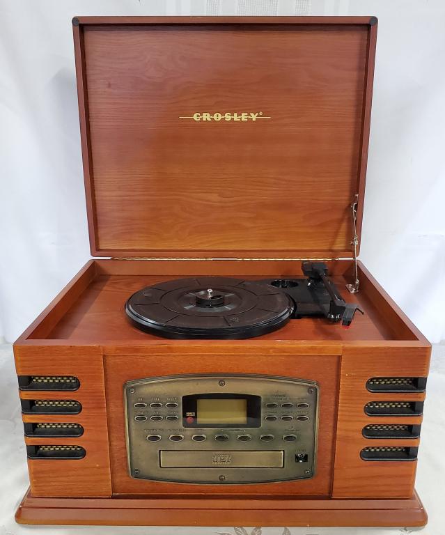 Crosley AM/FM Record Player Model CR78CD: Crosley AM/FM, CD, Cassette, Turntable Player. Model CR78CD. Deco Style No Remote. Works. There is a small chip on the inside as pictured. Apx. 16 1/2" W x 13 1/2" Deep x 9 1/2" H. Photo's are conside