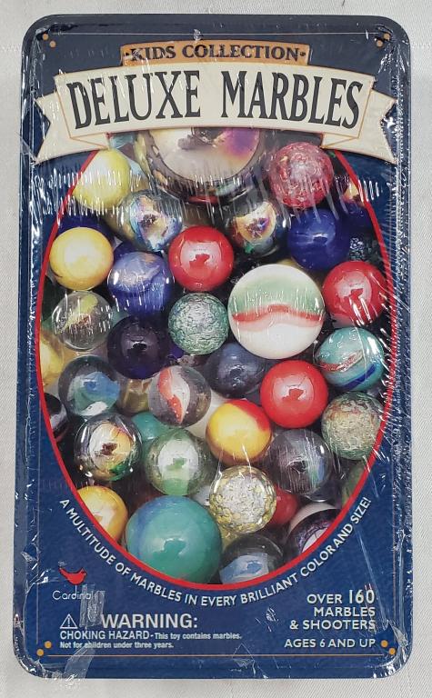 Kids Collection Deluxe Marbles in Sealed Tin: Kids Collection Deluxe Marbles in Sealed Tin. Over 160 Marbles nd Shooters. Tin Size Apx. 4 1/2" W x 7 1/2" L. Photo's are considered part of the description and condition.