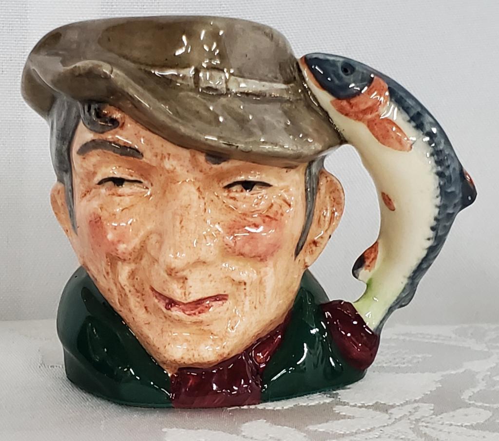 Miniature Royal Doulton" The Poacher" Toby Mug: Miniature Royal Doulton "The Poacher" Toby Mug. D6515. Apx. 2 1/2" H x 3" W. Photos are considered part of the description and condition.