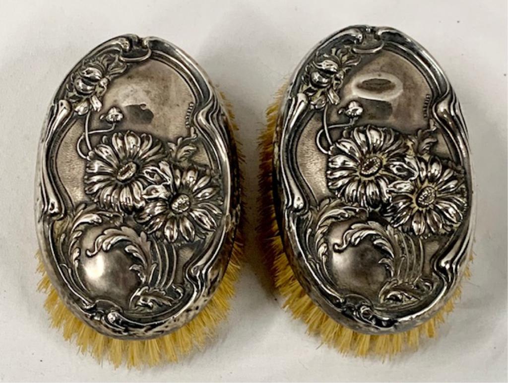 2 Beautiful Sterling Silver Gentlemen's Brushes: 2 Antique Beautiful Sterling Silver Gentlemen's Brushes. Floral Design. Has a few imperfections, dings, and bumps as pictured but still very nice. Apx. 4 1/4" x 2 1/2". Photos are considered part of t