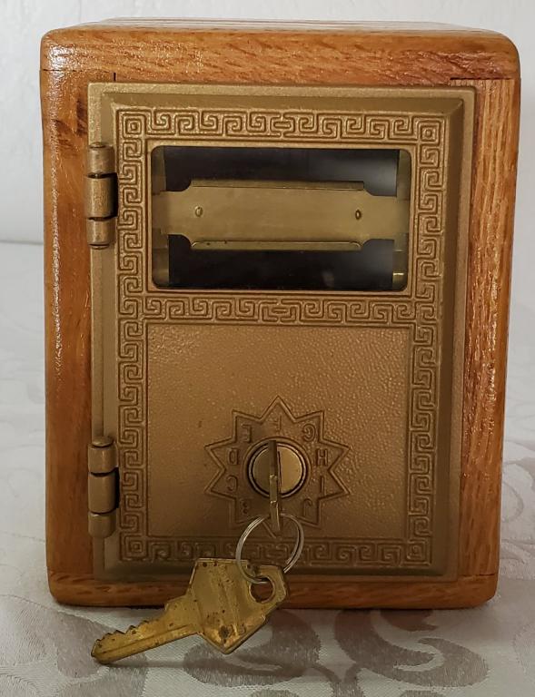 Post Office Lock Box: Post Office Lock Box. Original Post Office Door. Box is apx. 6" H x 4 1/2" L x 5" W. Door is attached upside down. Unlocks with a key - Includes Key. Photos are considered part of the description and