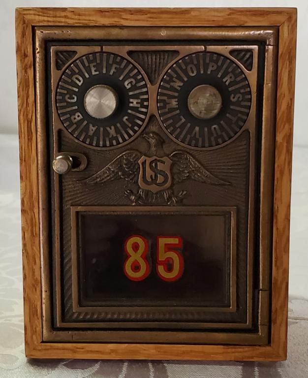 Post Office Lock Box: Post Office Lock Box. Eagle Decoration on Front. #85 Has Combination. Wood Box has a Coin Slot in the Top. Apx. Box Size 4 1/4" x 5 3/4" H. x 4 1/4". Photo's are considered part of the description and