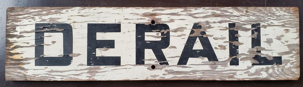 Vintage "Derail" Wood Sign: Vintage "Derail" Wood Sign. "R" is missing on one Side. Some paint distress. Apx. 27" L x 7" H. Photos are considered part of the description and condition.