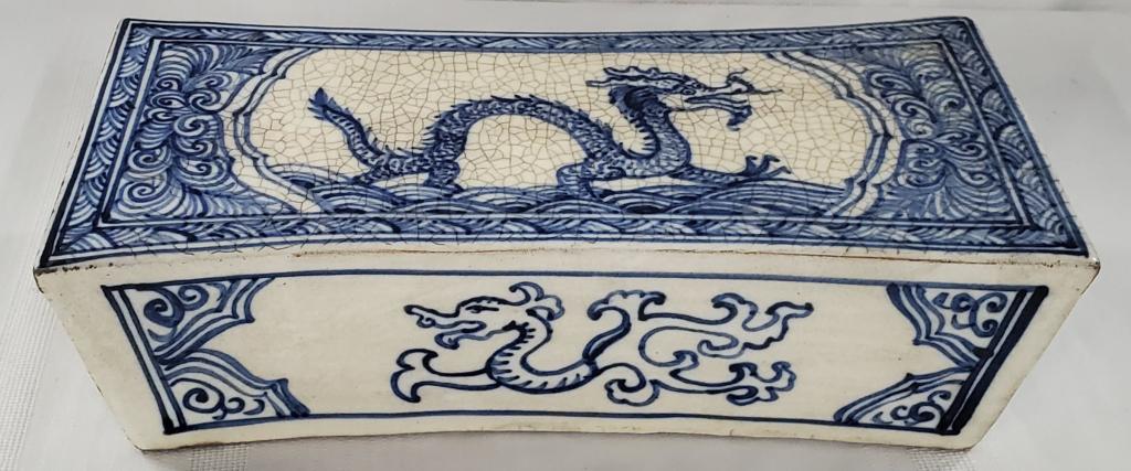 Porcelain Blue & White Opium Pillow: Porcelain Blue and White Opium Pillow. Asian/Dragon Design. Apx. 3 3/4 H x 12 1/2" W x 5 1/2" W. Photo's are considered part of the description and condition.