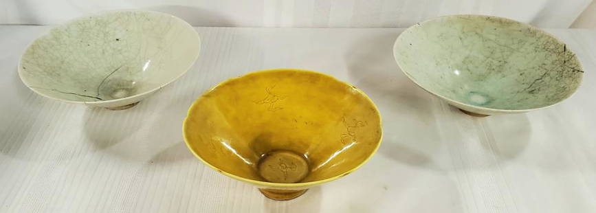 3 Asian Porcelain Bowls: 3 Asian Porcelain Bowls. *2 White/Grey Bowls Apx. 2 1/2" H x 7" Diameter. Both Bowls have cracks -one of these bowls has a serious crack as pictured. *Yellow Asian Bowl Apx. 2 1/2" H x 6 1/2" 