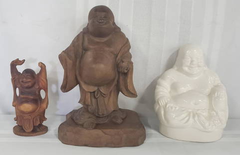 3 Assorted Happy Buddha's: 3 Assorted Happy Buddha's. *Wood Buddha - Apx. 5 1/4" H - Hand is broken. *Wood Buddha with Wood Stand Apx. 10" H Missing something from his hand - Signed.*White Porcelain Buddha - Apx. 7" H.