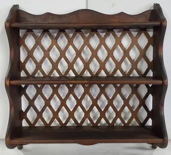 MCM 3 Tier Curio/Knick Knack Wood Wall Shelf: MCM 3 Tier Curio/Knick Knack Wood Wall Shelf. Lattice Back. Plate Grooves on Each Shelf. Apx. 22" H x 21 1/2" W x 6" Deep. Photos are considered part of the description and condition. 910