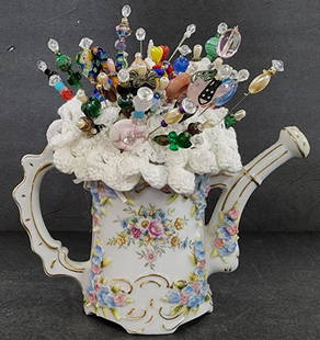 Elfinware Germany Porcelain Water Can Pin Cushion: Vintage Elfinware Germany Porcelain Water Can with Pin Cushion. Applied Flowers. Includes Pins. Apx. 8" H. Photo's are considered part of the description and condition. O