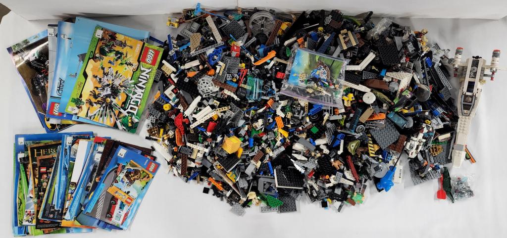 Large Assortment (100's) of Legos and Instructions: Large Assortment (100's) of Legos and Several Instruction Books. Assorted Sizes and Styles including Star Wars. Books do not necessarily represent the Legos included. Photo's are considered part of th