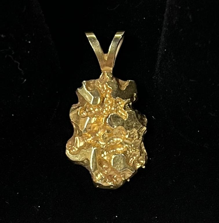 14k Nugget Pendant 4.8g: 14k Nugget Pendant 4.8g Marked on back: 5 GR. 14k. Photo's are considered part of the description and condition.