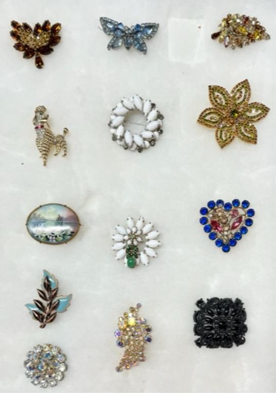 Assortment of Nice Brooches - Some Designer: 13 Beautiful Brooches - Some Designer. Colored Rhinestones - Aurora Borealis - Vintage Weiss-Continental - Matisse - Renoir - Crown Trifari. All Latches Work. All in Nice Condition. Photo's are consid