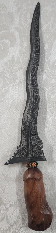 Keris Dagger: Keris Dagger. Both a weapon and a spiritual object. Wood Handle. Missing a Bead by the Handle. Apx. 13 1/4" L. Photos are considered part of the description and condition.