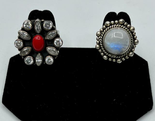 2 Nice Sterling Rings: 2 Nice Sterling Rings. *Sterling Ring - Flower Design with Red Center. Size 7. *Sterling Ring - Moonstone? Quartz? Marked 925. Size 6 1/2. Photo's are considered part of the description and condition.