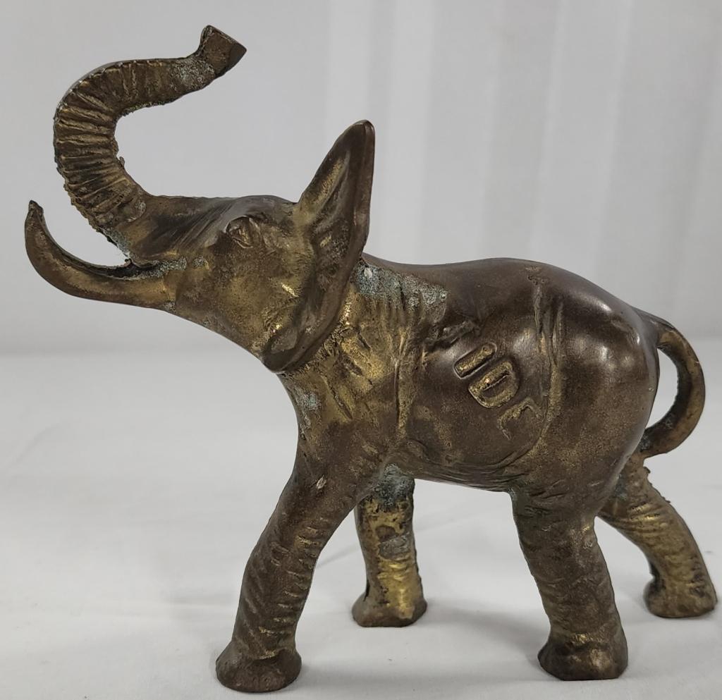 Brass "UA/Tide" Elephant: Brass "UA/Tide" elephant. - Approx. 5 1/2"L X 4 3/4"H. Photos are considered part of description and condition. 801-234