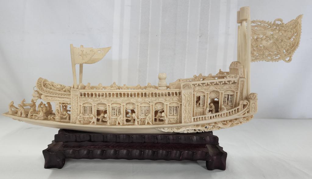 Vintage Hand Carved (?) Boat On Base: Vintage hand carved (?) boat on base. - ivory look Chinese pleasure barge. - some repairs. - chipped flag. - possibly missing center mast. approx. 9"H X 16"L. Photo's are considered part of the descri