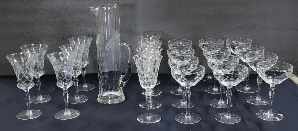 Iridescent Glassware: Iridescent glassware. * 2 sniffer glasses - approx. 5"H. * 6 wine glasses - approx. 6 1/2"H. * 11 parfait glasses. - approx. 4 1/2"H. * 8 small wine glasses - approx. 4 3/4"H. Photos are considered pa