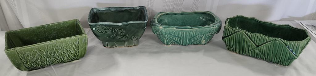 Collection (4) McCoy Pottery Planters: Collection (4) McCoy pottery planters. approx. sizes: * 2 3/4"H X 8"L x 4 1/4"W. * 3 1/4"H X 8"L X 4"W. * 3 1/4"H X 7"L X 4"W. * 3 1/2"H X 6 1/2"L X 4 1/2"W. Photo's are considered part of the descrip