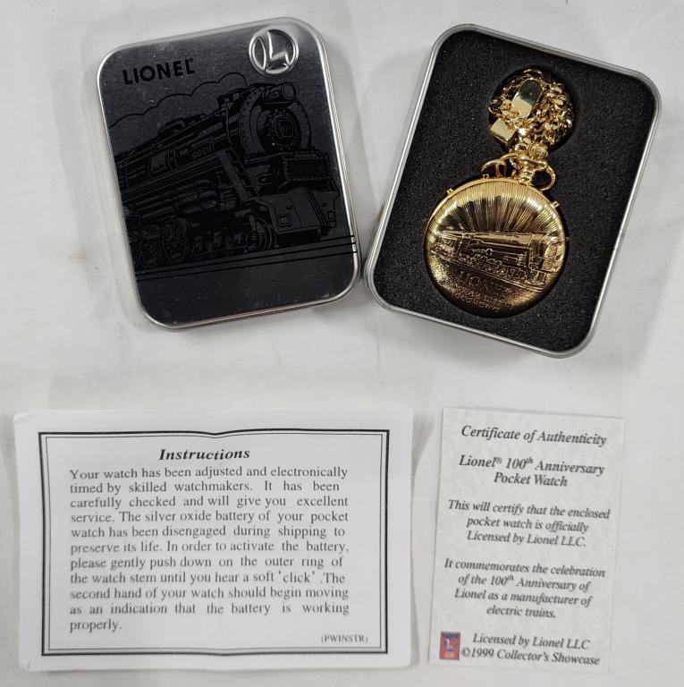 Lionel Pocket Watch With COA.: Lionel pocket watch with COA. - 100th anniversary. - with gold tone chain. - in Lionel tin. - approx. 2"D. Photo's are considered part of the description and condition.