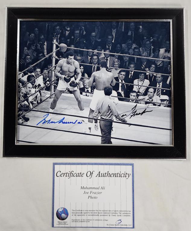 Ali & Frazier Signed Photograph With COA: Ali & Frazier signed photograph with COA. - approx. 8" X 10". Berners does not guarantee authenticity of signatures or COA. Photo's are considered part of the description and condition.
