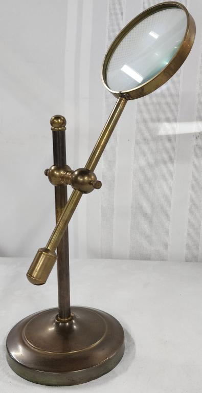 Vintage Brass Magnifying Glass: Vintage brass magnifying glass. - on an adjustable stand and swing arm. - approx. 13"H. Photo's are considered part of the description and condition.