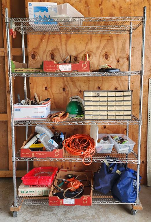 Assortment of Tools, Chains And Other Misc. Items: Assortment of tools, chains and other misc. items. * extension cords. * screw organizer. * Billy bass. * hard hat. * baseball glove. * reusable bags. * bike lock. * light bulbs * plastic totes. * chai