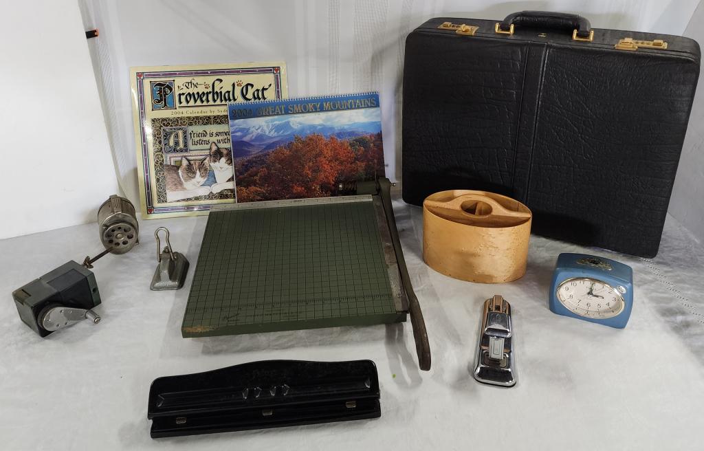 Vintage Office Supplies And Briefcase: Vintage office supplies and briefcase. * 2004 wall calendars. * premier paper cutter. * arrow stapler. * Timex desk clock - currently working. * pencil sharpeners. * falcon hole punch. * Allen Androki