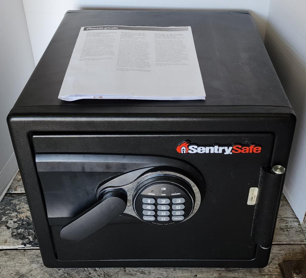 Sentry Safe: Sentry safe. - electronic fire safe. - model/serial #BW-119832. - paint peeling in back - as shown in pictures. - has instruction book and combination number. - made in USA. - approx.14"H X 16"L X 17"