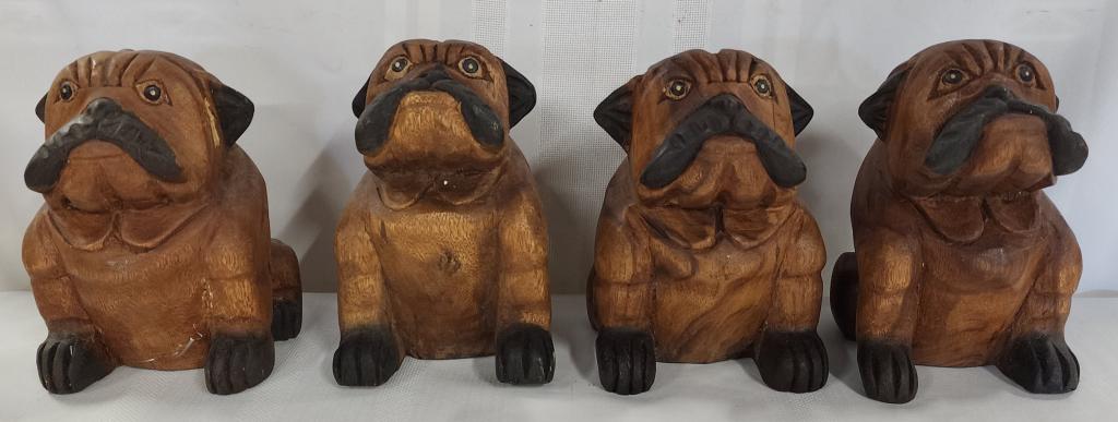 Collection of 4 Carved Wood Bulldogs: Collection of 4 carved wood bulldogs. - all have cracks as shown in pictures. - all are super cute for the bulldog lover!! - approx. 8"H. Photos are considered part of the description and condition.